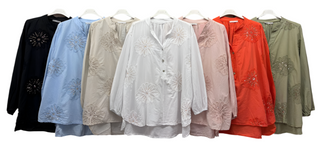 Blus med paljettblomma